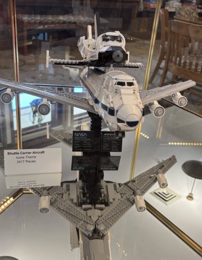 LEGO Shuttle Carrier Aircraft model with a space shuttle on top, displayed on a reflective surface.